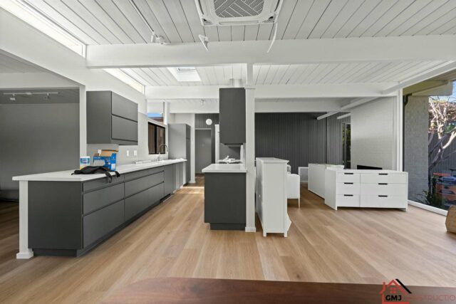 El Cajon Way renovation in progress in Palo Alto, showing kitchen cabinetry and exposed beams