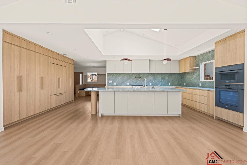 Samson Way kitchen remodel in San Jose with wood cabinetry and a green-veined island