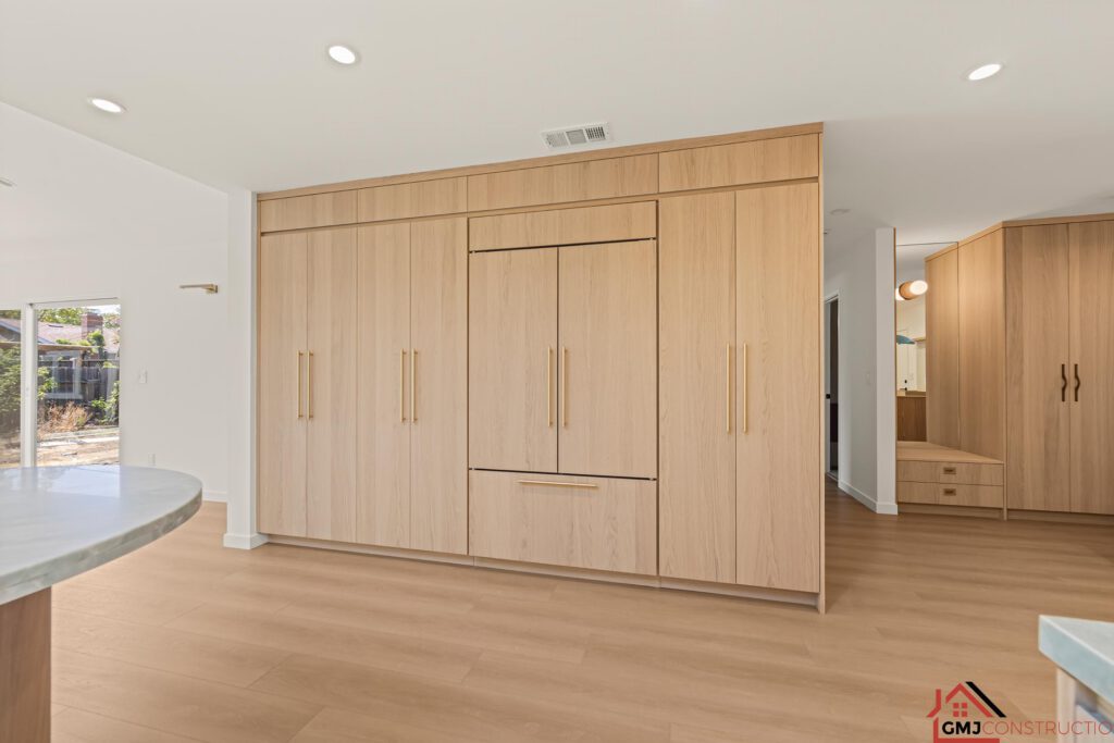 Full-height wood cabinetry beside the kitchen at Samson Way