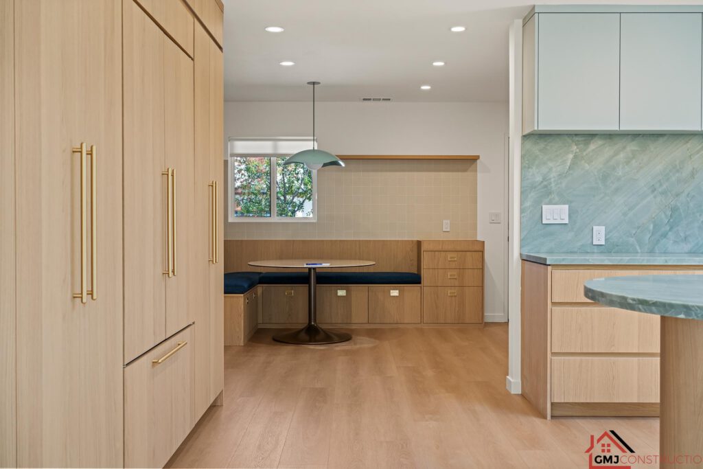View from the kitchen toward the built-in dining nook and curved seating