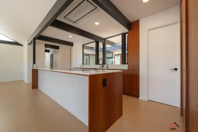 Alison Way kitchen island in Sunnyvale with wood cabinetry and a white panelled face